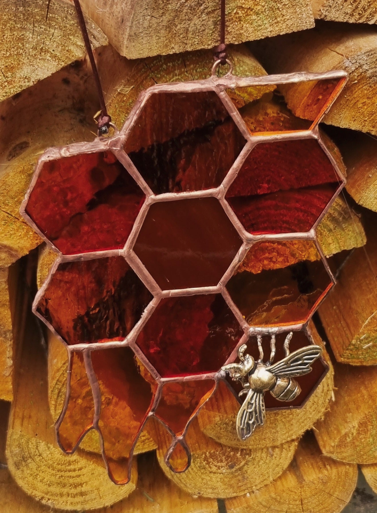 Honeycomb with bee suncatcher