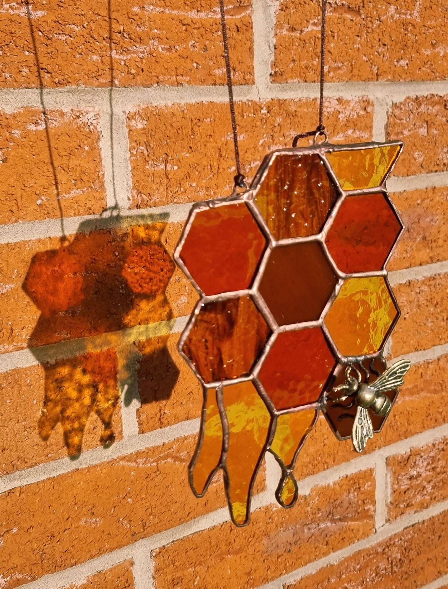 Honeycomb with bee suncatcher