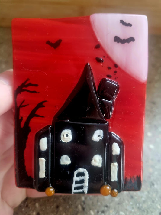 Spooky house tealight.